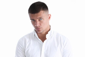 Fototapeta premium Portrait of a handsome young man in a white shirt