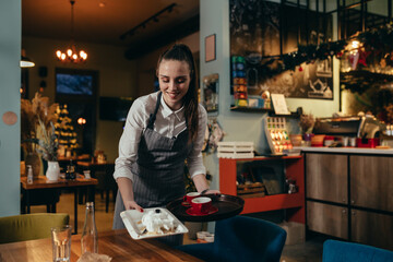 Fototapeta na wymiar waitress working in restaurant or cafe