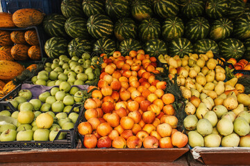 Fresh fruits on counter of outdoors market