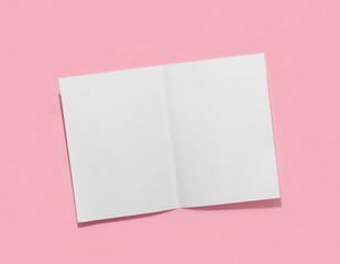 Fototapeta na wymiar Empty white paper sheet for text on pink background.