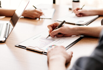 group of the employees analyzing financial charts