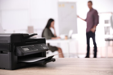 New modern printer on table in office. Space for text