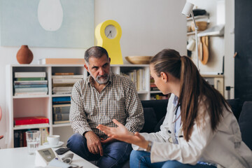 home nursing concept. doctor visits patient at his home