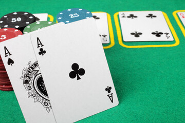 poker card game, winning combination two aces, close-up, selective focus.