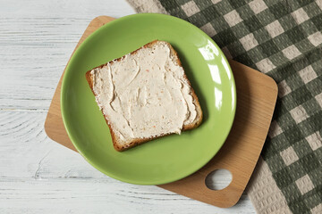 White toast bread with soft cream cheese, top view