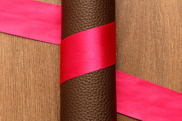 tape around the roll of genuine leather