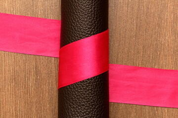 tape around the roll of genuine leather