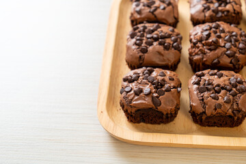 dark chocolate brownies topped by chocolate chips