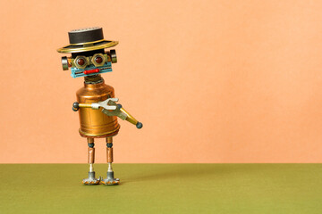 Creative design mechanical copper robot with a funny hat points his hands away from him. Peach...