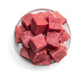 Fresh raw beef in ceramic plate isolated on white