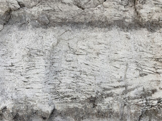 Top view of black, white, gray grunge textured rough stone background with cracks, scratches and stains. Creative concrete backdrop. 