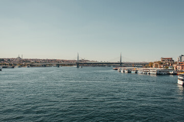 bridge over Bosphorus strait, and moored ships in Istanbul, Turkey
