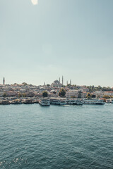vessels moored on seashore, and view of city from Bosphorus strait, Istanbul, Turkey