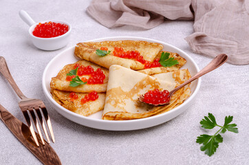 Fried crepes with red fish roe