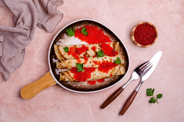 Fried crepes with red fish roe