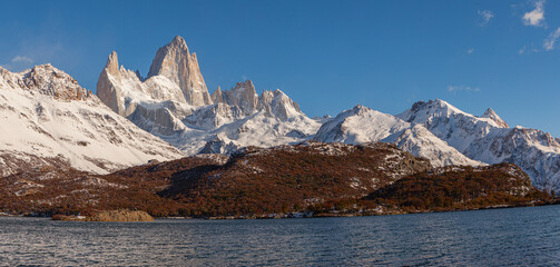 Panorama image of the Fitzroy mountain range with the lake 'Laguna Capri' in the foreground