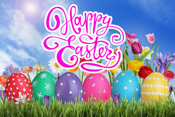 Happy Easter. Bright eggs and spring flowers on green grass outdoors