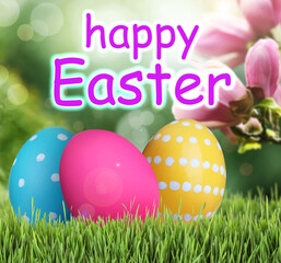 Happy Easter. Bright eggs on green grass outdoors