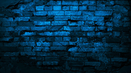 Dark blue old brick wall. Сlose-up. Collapsing brickwork. Grunge background with copy space for...
