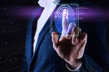 Man using biometric fingerprint scanner on dark background, closeup