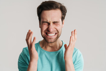 Fototapeta premium Stressed upset man suffering from a strong migraine