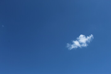 Small white cloud in clear blue sky at daytime