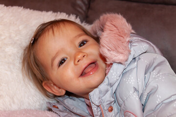 smiling baby on a sofa