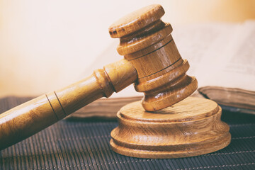 Judge's gavel and old book