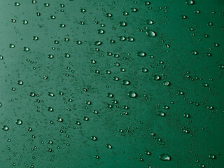 Random water drops on the green PVC surface