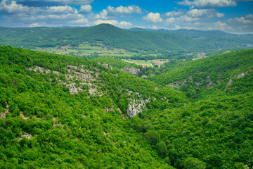 Fototapeta na wymiar Amazing mountain landscape - covered with green forest slopes of the Larazev canyon in Eastern Serbia