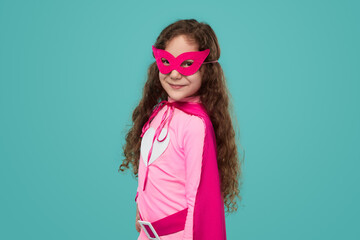 Cute superhero kid girl looking at camera © kegfire