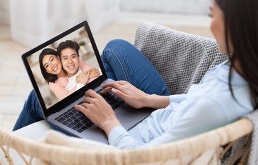 Distant virtual communication, modern devices, video call to friends and family in living room...