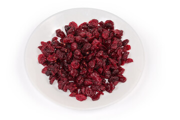 Dried cranberries on dish on white background