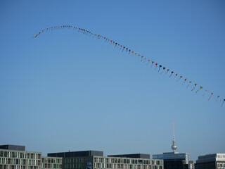 Long kite over Berlins skyline