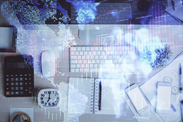 Multi exposure of forex graph drawing over desktop background with computer. Concept of financial...