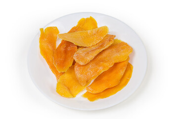 Dried mango slices on dish on a white background