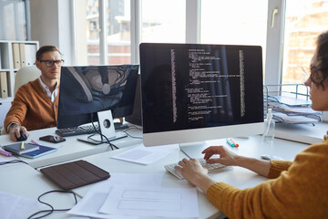 IT Programmer Using Computer in Office