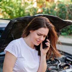 Scared woman in stress portrait near auto crash calling to auto insurance for help. Driver woman...