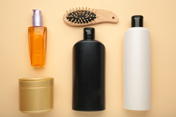 A lot of different cosmetic products for hair care on beige