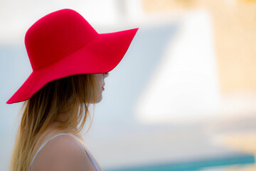 Young beauty woman relaxing  beside the swimming pool .