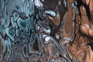 Abstract fluid art background blue and bronze colors. Liquid marble. Acrylic painting on canvas with brown gradient.