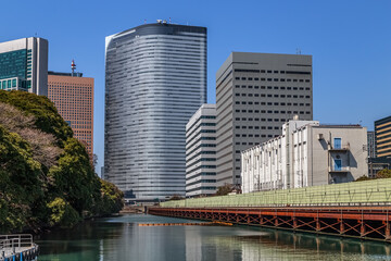 Fototapeta premium Industrial landscape seen from the water in Odaiba, artificial island in Tokyo bay, Japan.