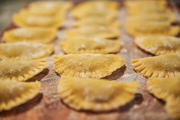 Preparing traditional italian ravioli. Homemade italian pasta.