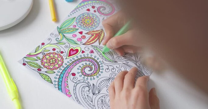 Coloring book for adults. Drawing as a hobby. Concentration activities to relieve stress.