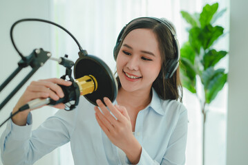content creator occupation concept. Woman adjusting microphone prepare to record podcast audio...