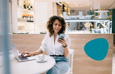 Smiling female manager using digital cellphone gadget for checking delivery service via online app...