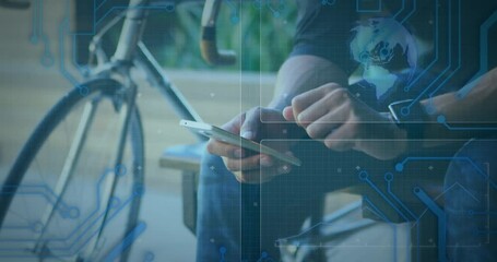 Animation of globe spinning and data processing on screens over man using smartphone and smartwatch - Powered by Adobe