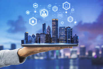 Cloud technology in smart city concept with human hand carries digital tablet with megapolis city skyscrapers and digital social network symbols above at skyline background