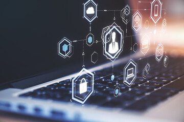 Corporate social network concept with digital media icons above laptop keyboard