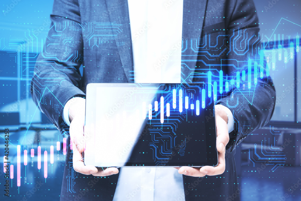 Poster Financial and algorithmic trading concept with businessman shows digital tablet display and virtual screen with growing stock market graphs